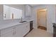 Well-lit kitchen featuring white cabinets and countertops, and stainless steel appliances at 233 45Th Ave, St Pete Beach, FL 33706