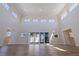 Expansive living room showcases high ceilings, abundant natural light and wood-look flooring at 233 45Th Ave, St Pete Beach, FL 33706
