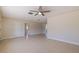 Spacious living room offering neutral walls, tile floors, and a ceiling fan at 233 45Th Ave, St Pete Beach, FL 33706