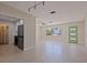 Bright living space open to kitchen with tile floors, neutral walls, and modern fixtures at 233 45Th Ave, St Pete Beach, FL 33706