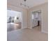 Open-concept living space with tile floors flowing into a well-lit kitchen at 233 45Th Ave, St Pete Beach, FL 33706