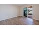This living room features hardwood floors and sliding glass doors, for seamless indoor-outdoor living at 233 45Th Ave, St Pete Beach, FL 33706
