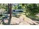 Expansive backyard with mature trees, hammock, creating a serene and inviting outdoor space at 27477 Old Trilby Rd, Brooksville, FL 34602