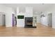 Open living room with fireplace and light wood floors, great for entertaining at 27477 Old Trilby Rd, Brooksville, FL 34602