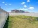 Spacious backyard featuring a well-maintained lawn and privacy fence, perfect for outdoor activities at 2870 Silver Scallop Dr, Wimauma, FL 33598