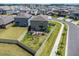 Aerial view of fenced backyard with patio furniture, ideal for entertaining and outdoor relaxation at 2870 Silver Scallop Dr, Wimauma, FL 33598