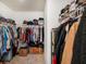 A walk-in closet with clothing racks and shelving for organized storage of clothing and accessories at 2870 Silver Scallop Dr, Wimauma, FL 33598