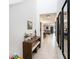 Bright hallway with tile flooring and decorative mirrors, leading to the living area at 2870 Silver Scallop Dr, Wimauma, FL 33598