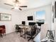 Office space featuring multiple desks, monitors, and comfortable seating at 2870 Silver Scallop Dr, Wimauma, FL 33598