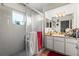 Clean bathroom with a glass-enclosed shower and a vanity with lots of storage at 29133 Lawton Dr, Nobleton, FL 34661