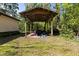 View of carport filled with various household items and tools at 29133 Lawton Dr, Nobleton, FL 34661