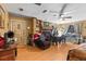Inviting living room featuring a fireplace, built-in shelving, wood-look floors, and a cozy seating area at 29133 Lawton Dr, Nobleton, FL 34661