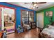 View of living room with wood-look floors and colorful accent walls at 29133 Lawton Dr, Nobleton, FL 34661