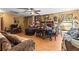 Cozy living room with hardwood floors, a fireplace, a ceiling fan and comfortable furniture at 29133 Lawton Dr, Nobleton, FL 34661