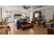 Spacious main bedroom with a ceiling fan, wood floors, and an ensuite bathroom at 29133 Lawton Dr, Nobleton, FL 34661