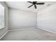 Bright carpeted bedroom with ceiling fan at 3065 Living Coral Dr, Odessa, FL 33556