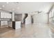 Spacious, light-filled living room featuring tile floors, recessed lighting and a modern ceiling fan at 3065 Living Coral Dr, Odessa, FL 33556
