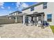 Back patio featuring a paver surface and gazebo, perfect for outdoor gatherings and relaxation at 3065 Living Coral Dr, Odessa, FL 33556