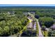 Townhome community with lush green trees surrounding the properties at 3135 Charter Club Dr # G, Tarpon Springs, FL 34688