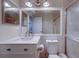 Bathroom with vanity, updated faucet, updated lighting, and glass shower at 3135 Charter Club Dr # G, Tarpon Springs, FL 34688