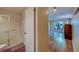View from hallway to bathroom featuring glass shower, toilet, and sink at 3135 Charter Club Dr # G, Tarpon Springs, FL 34688