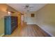 Bedroom featuring laminate floors, closet, wall decor, and a ceiling fan at 3135 Charter Club Dr # G, Tarpon Springs, FL 34688