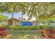 Community sign surrounded by lush landscaping, creating a welcoming entrance at 3135 Charter Club Dr # G, Tarpon Springs, FL 34688