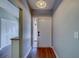 Entryway featuring wood-look flooring and a view into the living space at 3135 Charter Club Dr # G, Tarpon Springs, FL 34688