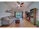 Cozy living room with wood floors, sliding glass doors to the lanai and lots of natural light at 3135 Charter Club Dr # G, Tarpon Springs, FL 34688