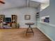 Bright and airy living room with vaulted ceilings, wood floors, and an open concept to the kitchen at 3135 Charter Club Dr # G, Tarpon Springs, FL 34688