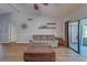 Living room featuring vaulted ceilings, a couch, and a large ottoman at 3135 Charter Club Dr # G, Tarpon Springs, FL 34688