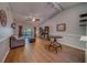 Bright and airy living room with vaulted ceilings, wood floors, and sliding glass doors to the patio at 3135 Charter Club Dr # G, Tarpon Springs, FL 34688