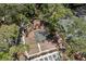Aerial view of basketball court in community surrounded by mature trees at 3241 Fox Chase N Cir # 106, Palm Harbor, FL 34683