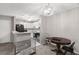 Efficient kitchen layout with appliances and adjacent dining area at 3241 Fox Chase N Cir # 106, Palm Harbor, FL 34683