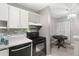 Well-lit kitchen featuring modern appliances and ample cabinet space for storage at 3241 Fox Chase N Cir # 106, Palm Harbor, FL 34683