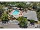 Community offers pool, tennis court and shuffleboard surrounded by trees at 3241 Fox Chase N Cir # 106, Palm Harbor, FL 34683
