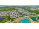 Aerial view of the community, showcasing the lush landscaping and nearby lakes at 32648 Coldwater Creek Loop, Wesley Chapel, FL 33545