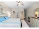 Spacious primary bedroom with a ceiling fan and views to the hallway and ensuite at 32648 Coldwater Creek Loop, Wesley Chapel, FL 33545