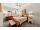 Comfortable bedroom with dresser, bedside table, and a ceiling fan at 32648 Coldwater Creek Loop, Wesley Chapel, FL 33545