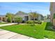 Well-maintained home with lush green lawn and mature landscaping at 32648 Coldwater Creek Loop, Wesley Chapel, FL 33545