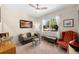 Inviting living room with comfortable seating, natural light, and stylish decor elements at 32648 Coldwater Creek Loop, Wesley Chapel, FL 33545