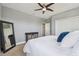 Bright bedroom featuring neutral colors, carpet flooring, ceiling fan, and ample closet space at 32791 Natural Bridge Rd, Wesley Chapel, FL 33543