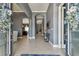 View of the front entry showing gray walls, arched entryways, and tile flooring at 32791 Natural Bridge Rd, Wesley Chapel, FL 33543