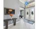 Spacious foyer with ceramic tile flooring, modern decor and a view of the front door at 32791 Natural Bridge Rd, Wesley Chapel, FL 33543