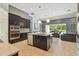 Open kitchen featuring a center island and dark cabinetry at 32791 Natural Bridge Rd, Wesley Chapel, FL 33543