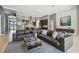 A spacious living room featuring stylish decor, neutral paint, and ample seating at 32791 Natural Bridge Rd, Wesley Chapel, FL 33543