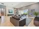 Spacious living room featuring a large window, tile floors, and modern decor at 32791 Natural Bridge Rd, Wesley Chapel, FL 33543