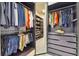 Spacious custom walk-in closet with built-in shelving and organization at 32791 Natural Bridge Rd, Wesley Chapel, FL 33543
