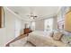Bright bedroom features plush carpeting, ceiling fan, and a comfortable bed at 334 Mystic Falls Dr, Apollo Beach, FL 33572