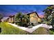 Charming single-story home with a well-manicured lawn, lush landscaping, and a two-car garage at 334 Mystic Falls Dr, Apollo Beach, FL 33572